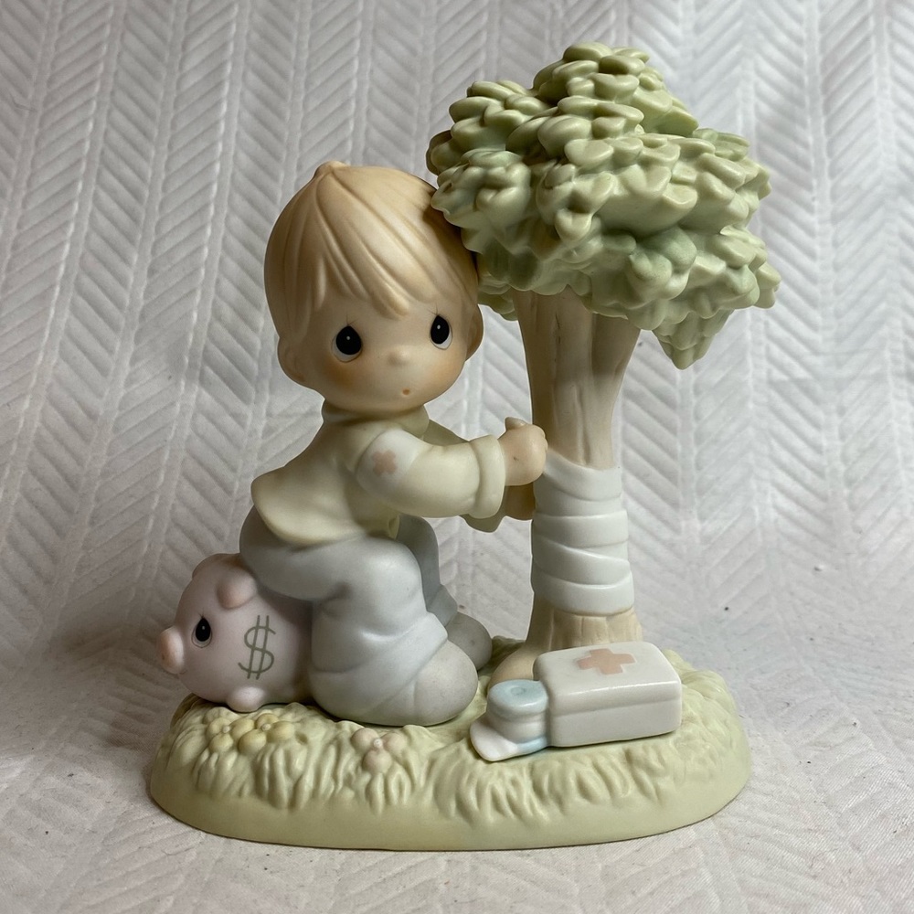 Precious Moments ‘Money’s Not the Only Green Thing Worth Saving’ (1994).